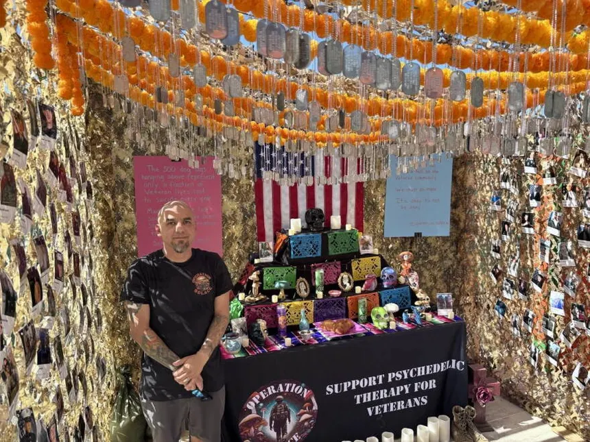 Gabriel Gonzales beside the Operation Solace memorial altar.